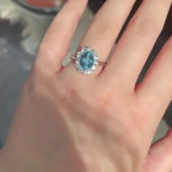 Bague de fiançailles en argent sterling avec halo d'aigue-marine de taille ovale