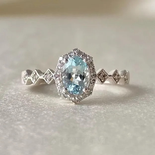 Bague de fiançailles en argent sterling avec halo d'aigue-marine de taille ovale