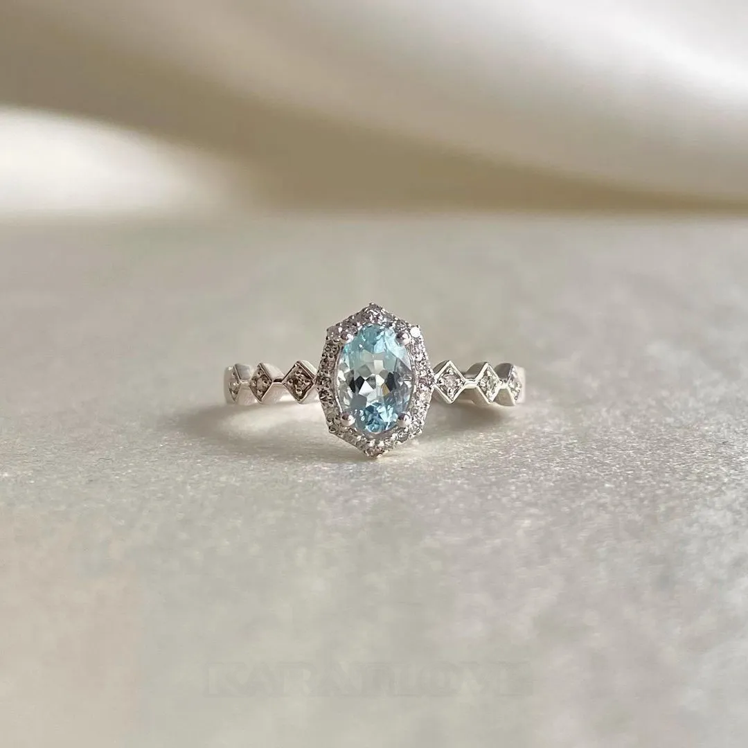 Bague de fiançailles en argent sterling avec halo d'aigue-marine de taille ovale