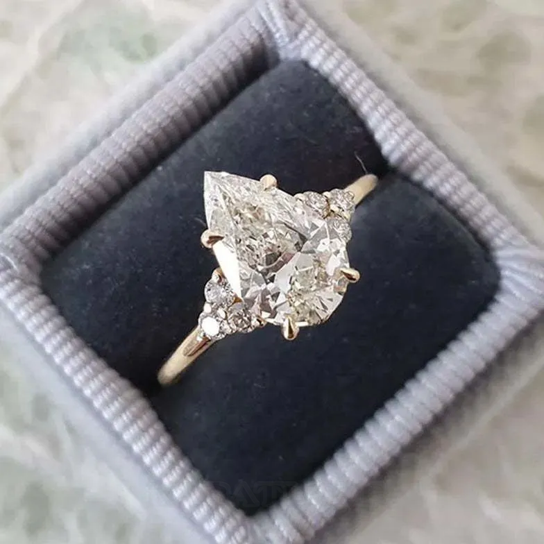 Bague de fiançailles 3 pierres en argent jaune et diamant poire blanc