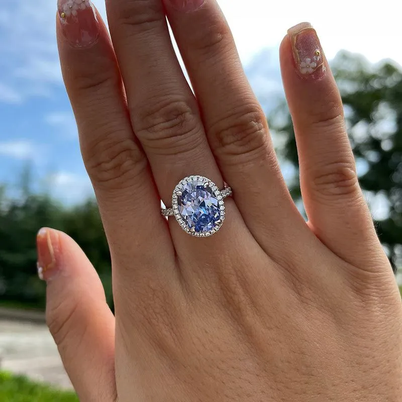Bague de fiançailles en argent sterling avec halo en saphir bleu à taille ovale