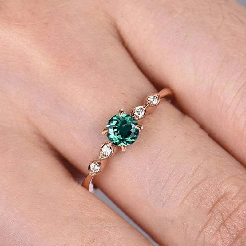 Bague de fiançailles en argent rose avec émeraude verte de taille ronde
