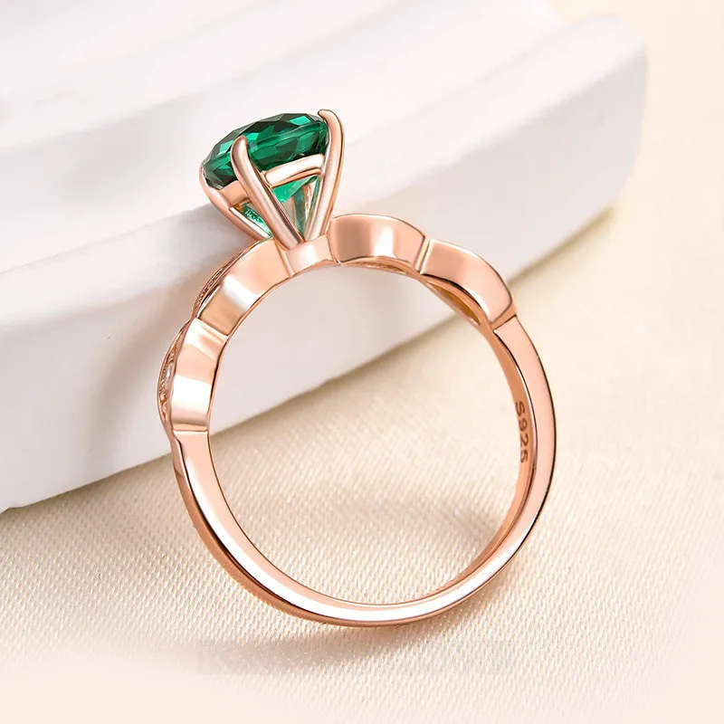 Bague de fiançailles en argent rose avec émeraude verte de taille ronde
