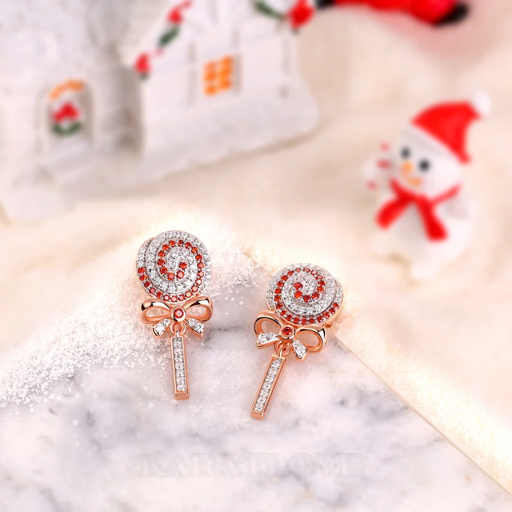 Boucles d'oreilles pendantes en argent sterling ornées de diamants blancs et rubis taille ronde avec un motif sucette et nœud