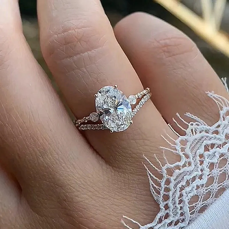Bague 3 pierres en argent jaune et or blanc avec diamant ovale