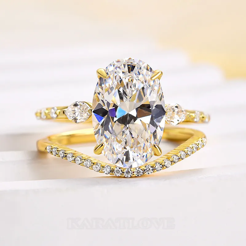Bague 3 pierres en argent jaune et or blanc avec diamant ovale