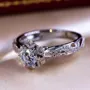 Bague de fiançailles art deco halo en argent 925 avec diamant rond et blanc