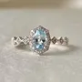 Bague de fiançailles en argent sterling avec halo d'aigue-marine de taille ovale
