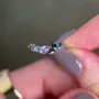 Bague de fiançailles en argent rose et saphir bleu à taille ovale