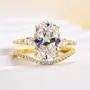 Bague 3 pierres en argent jaune et or blanc avec diamant ovale