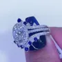 Anneau de mariage en argent sterling serti d'un halo en argent sterling et d'un saphir blanc à taille ovale