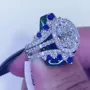 Anneau de mariage en argent sterling serti d'un halo en argent sterling et d'un saphir blanc à taille ovale
