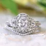 Ensemble de bague de mariage en argent sterling avec halo et diamant blanc ovale vintage